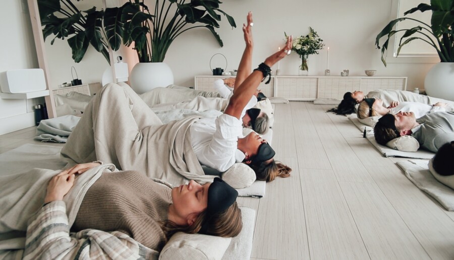 Guests laying down in breathwork journey